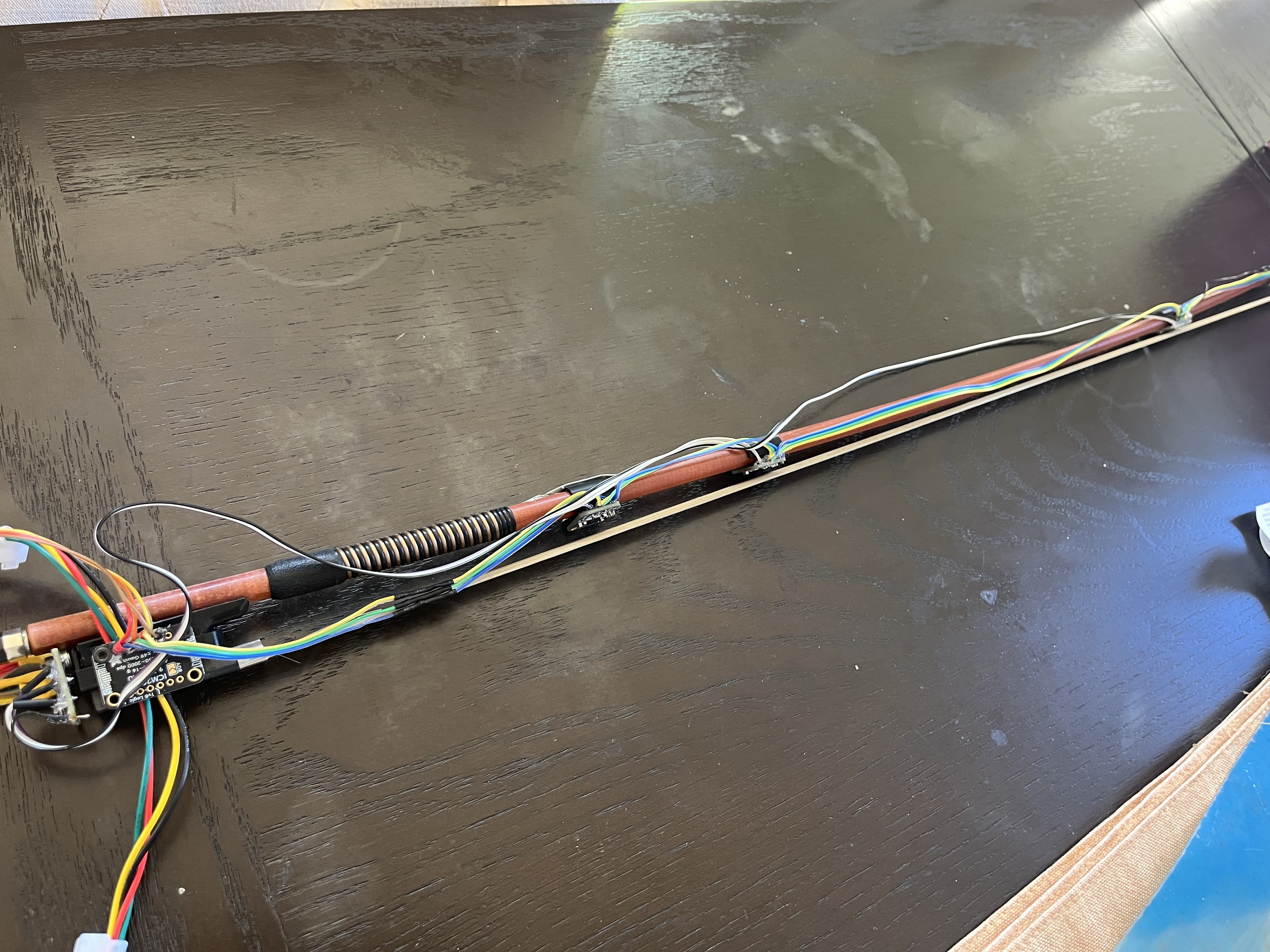 Sensor-equipped violin bow.